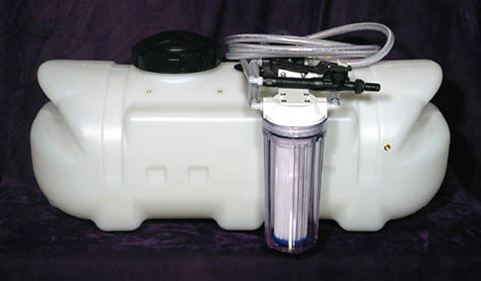 Enclosed shampoo machine with wand and pump setup for dog grooming.