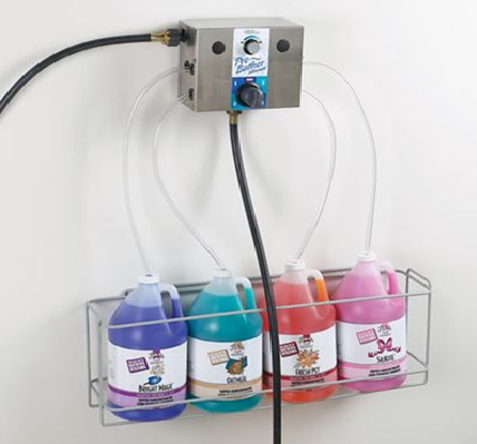 Vacuum draw dog grooming shampoo machine mounted for bathing work in a grooming room.