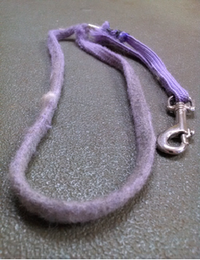 Fabric grooming noose showing the loop and stop design used for dog grooming table restraint.