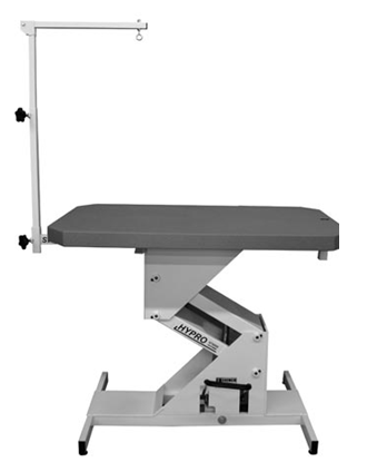Commercial grade hydraulic grooming table example showing heavy base and professional table construction.